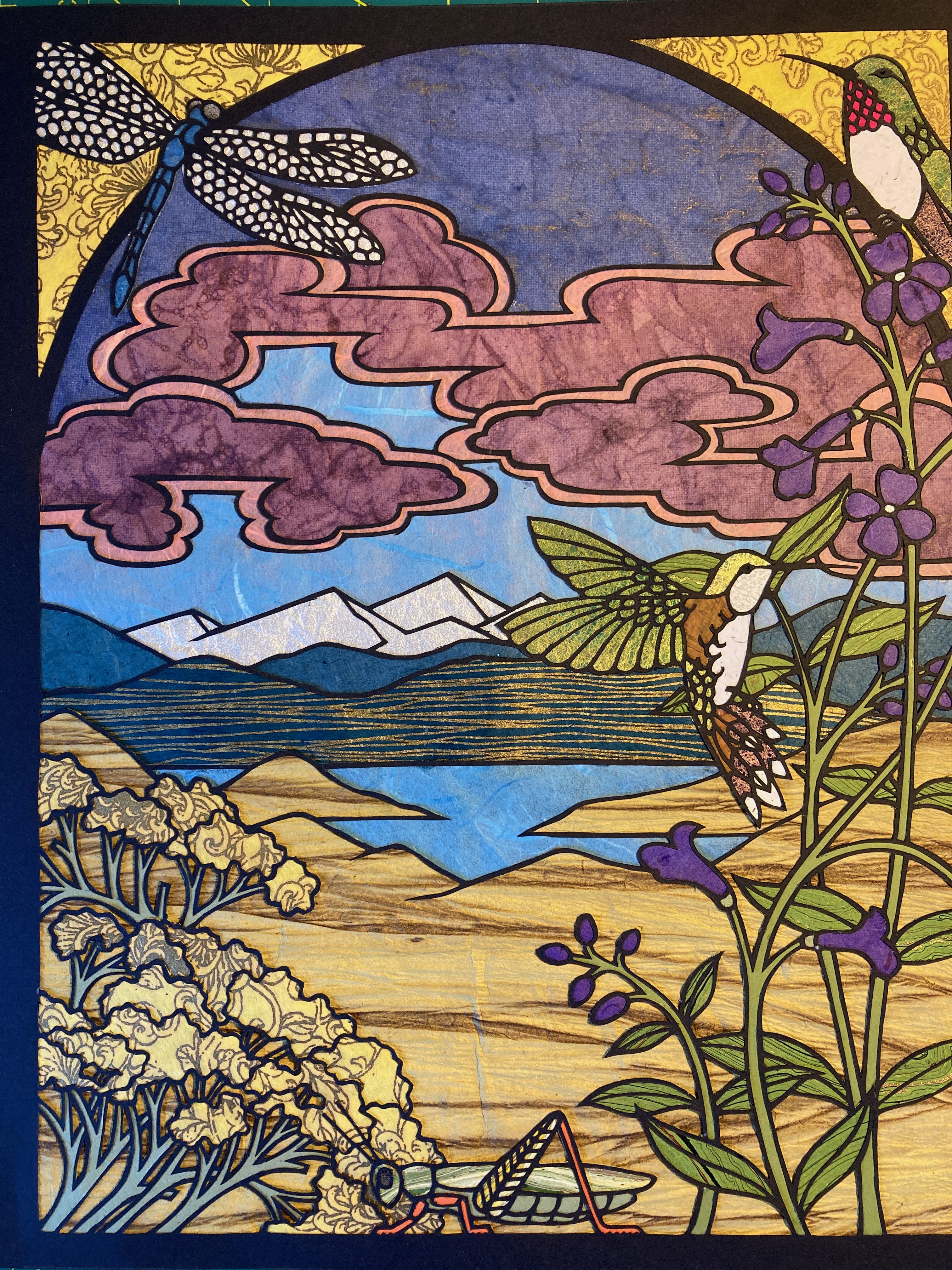 Colorado landscape paper cut with dragonfly, hummingbird, mountains, and rabbitbush flowers